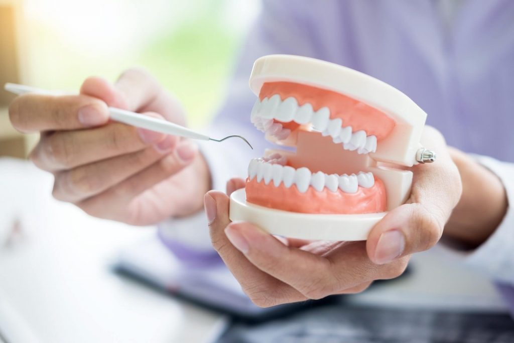 Dental procedure showing root canal treatment